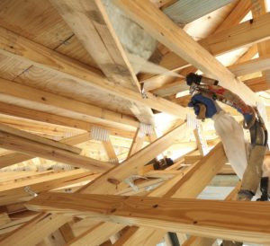 Spray foam insulation being installed in a new-construction building.